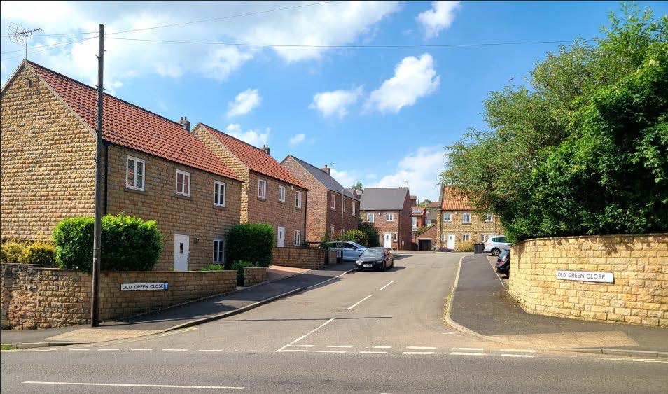 Detached housing along a residential street.