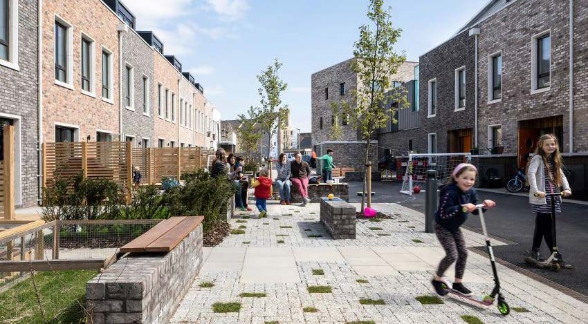 A modern design incorporates local stone and provides a strong street scene based on traditional terraces. Uses native street trees to provide a positive setting.